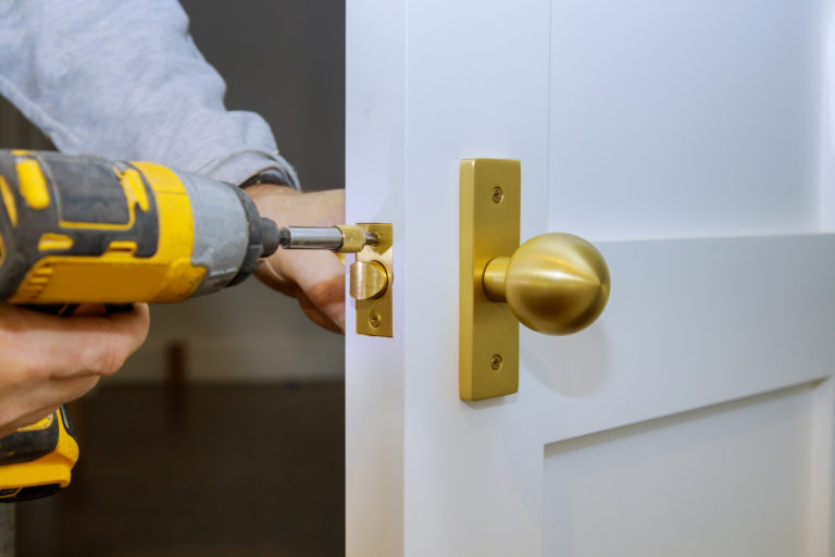 man drilling locks commercial locksmith services in tallahassee, fl – efficient and trusted locksmith services for your office and business